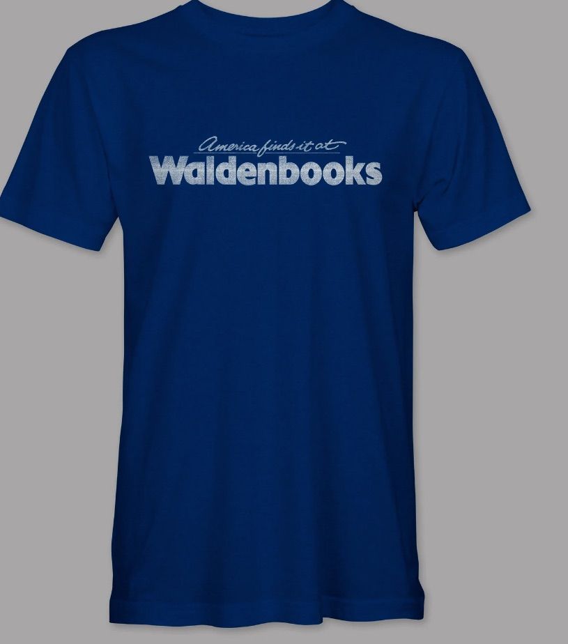Image of a dark blue t-shirt. It has the words "America finds it at Waldenbooks."