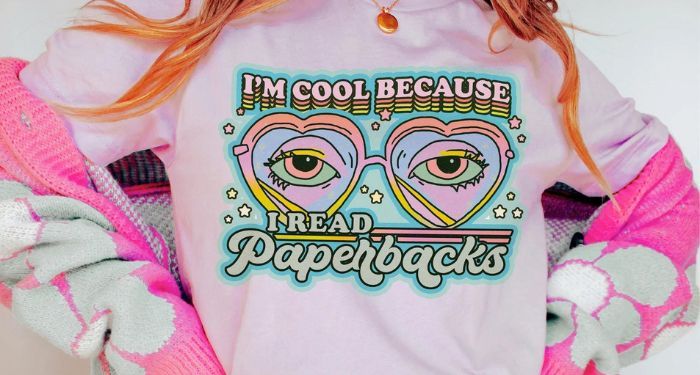 closeup of a shirt image that says "I'm cool because I read paperbacks."