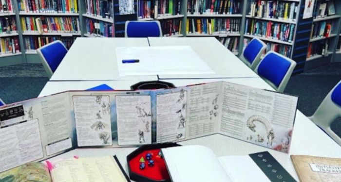 table with D&D material on it at a library