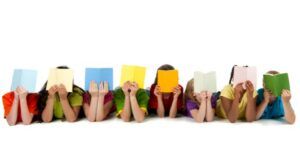 Image of 8 diverse children reading colorful books