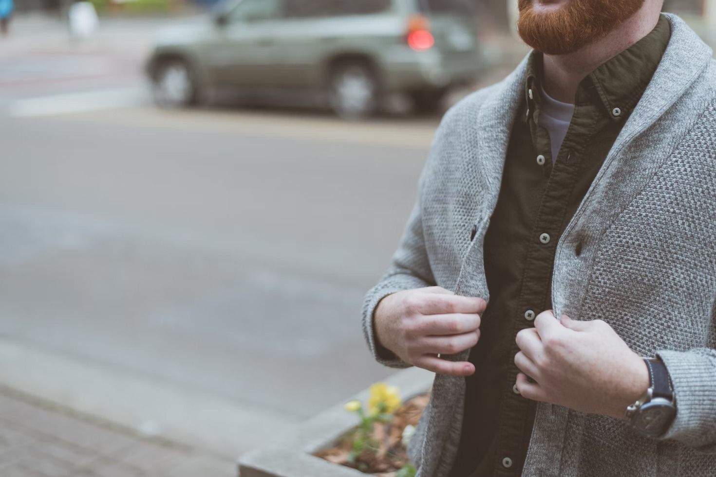 a photo of a man wearing a cardigan