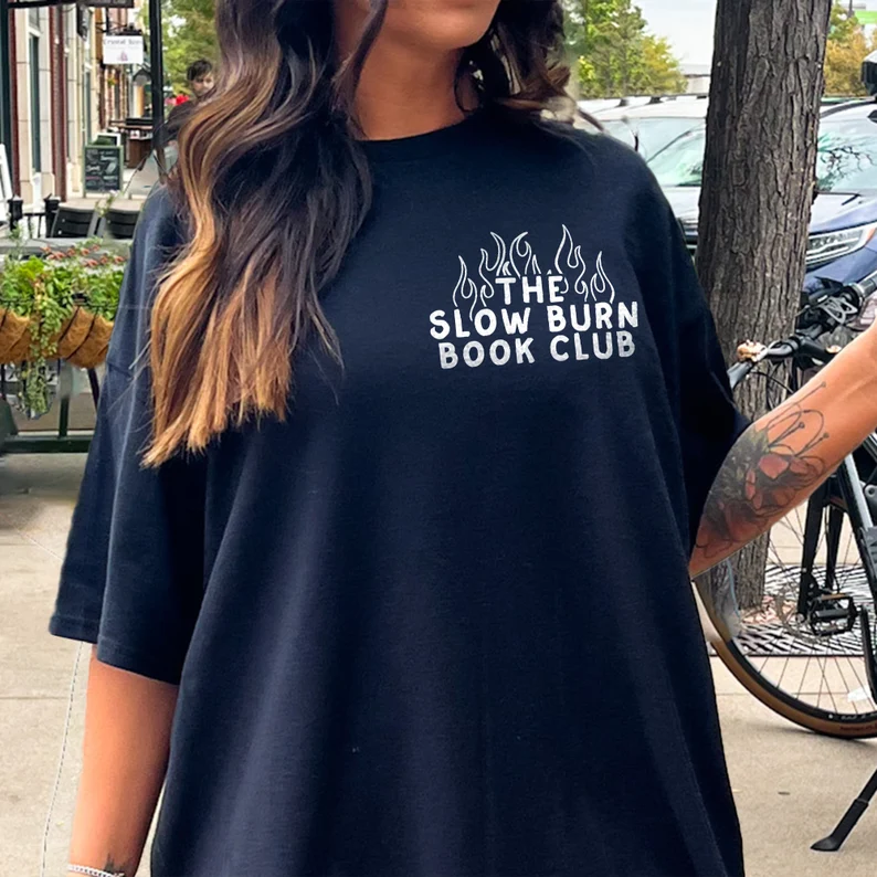 Shirt reading "The Slow Burn Book Club" surrounded by flames