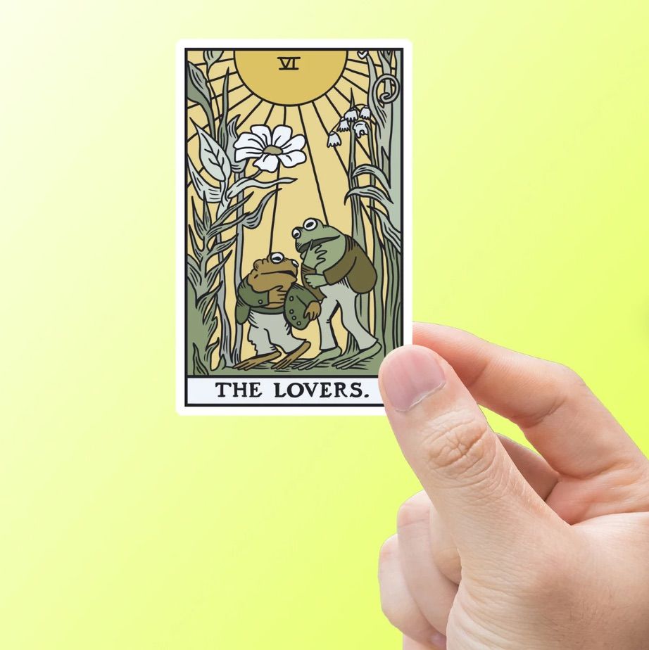 A frog and toad sticker in the design of The Lovers tarot card