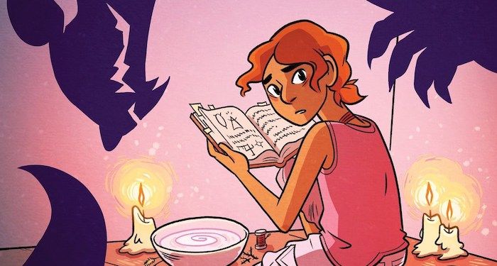 the cropped cover of Witch Boy, showing a kid reading a spellbook and looking over their shoulder with a shadow of a dragon in the background