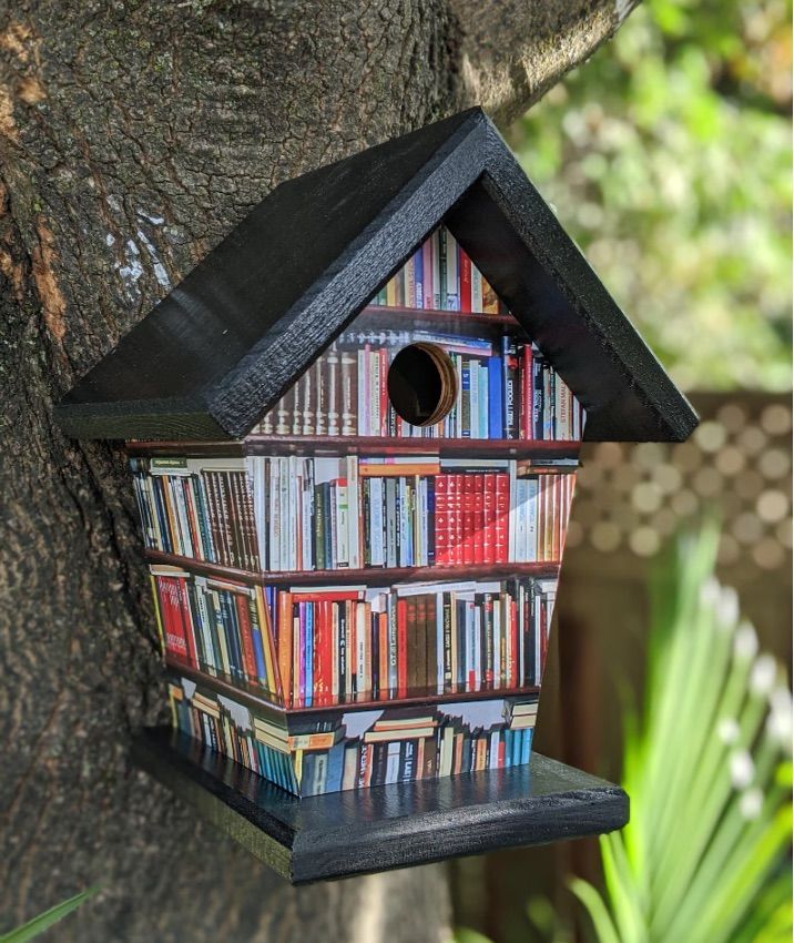 Image of a birdhouse decorated with books 