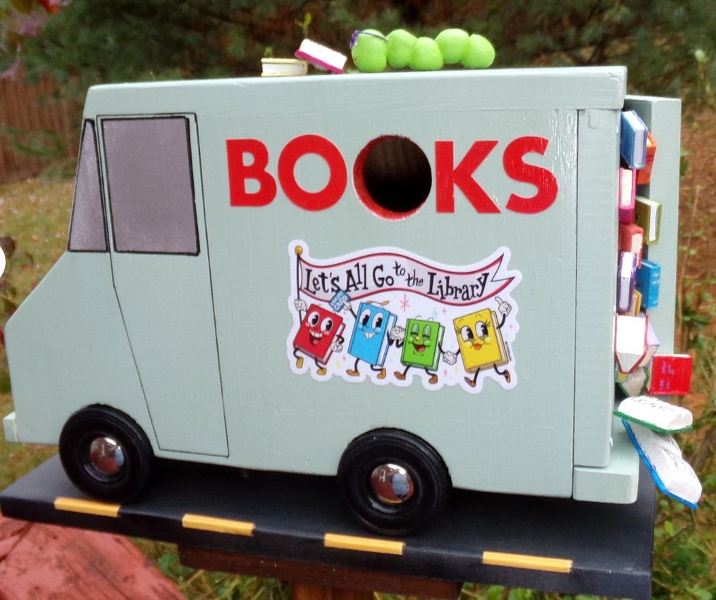 Image of a bookmobile birdhouse. 