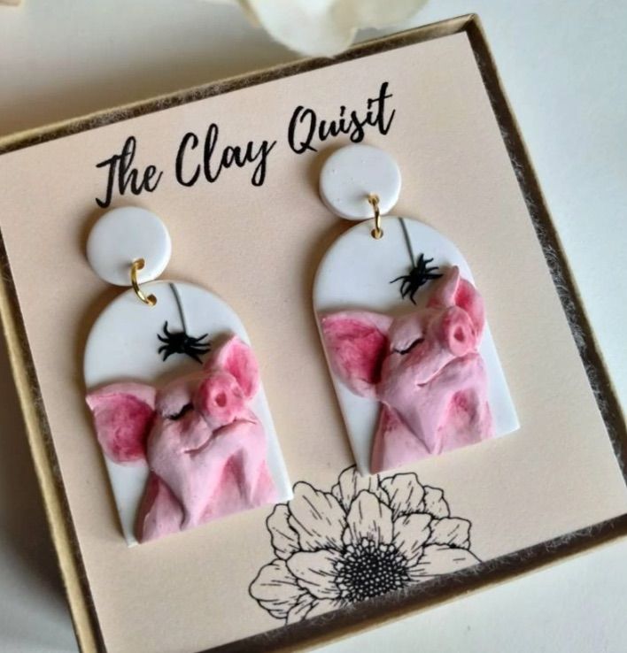 Image of pink polymer clay pig earrings.