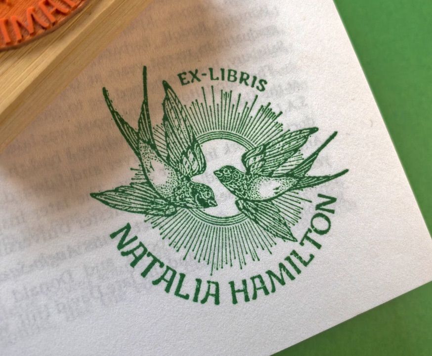 Image of a book stamp featuring birds. 