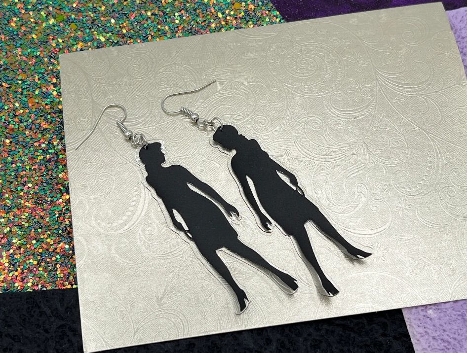 Image of a pair of nancy drew earrings.