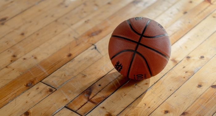 Image of a basketball on a hardwood court