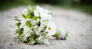 a photo of a wedding bouquet on the ground