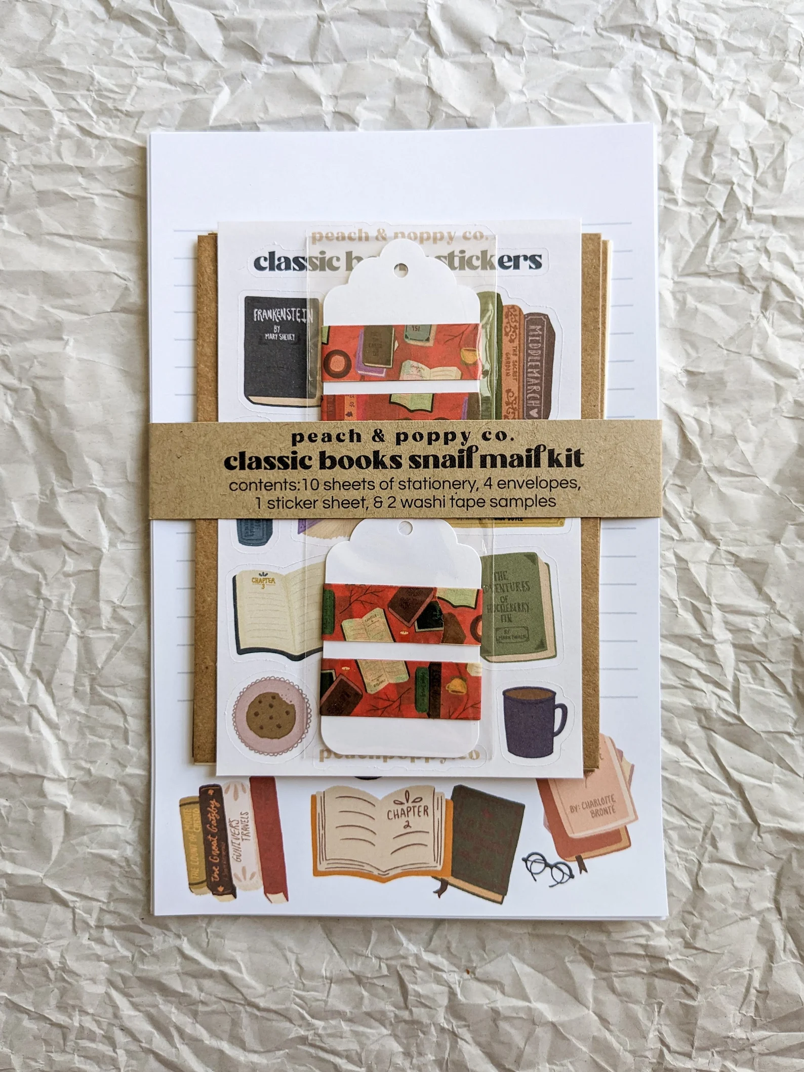 a collection of note sheets, stickers, and envelopes with a classic book theme