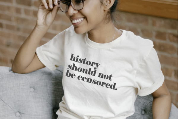 White shirt with black text reading "history should not be censored"