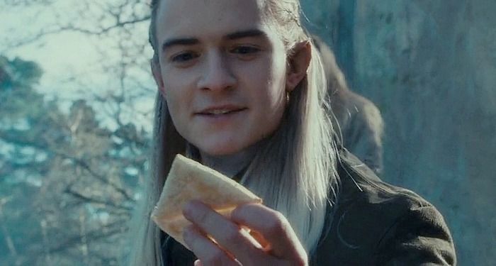 a still from Lord of the Rings showing Legolas holding lembas bread