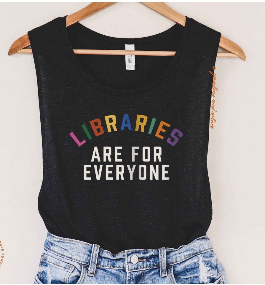 Image of a black tank top with the phrase "libraries are for everyone." Libraries is in rainbow colors. 