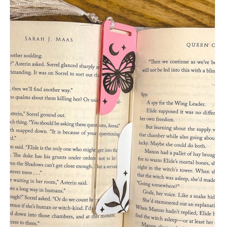Image of a pink and white acrylic butterfly bookmark.
