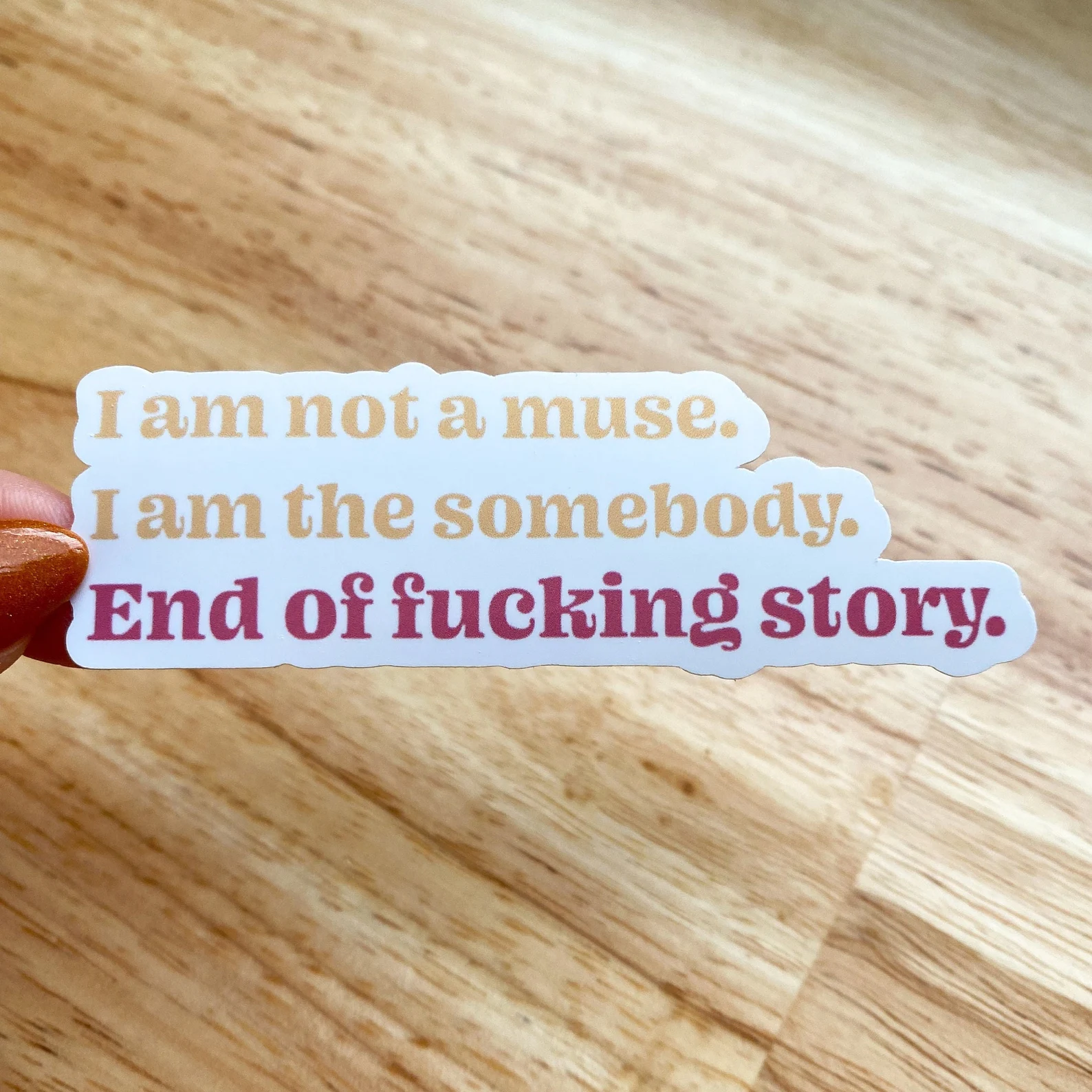 a sticker that reads "I am not a muse. I am the somebody. End of fucking story."