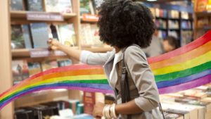 a photo of someone browsing books with a rainbow watercolor illustration superimposed between them and the bookshelf