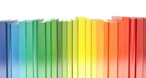 books shelved in rainbow order