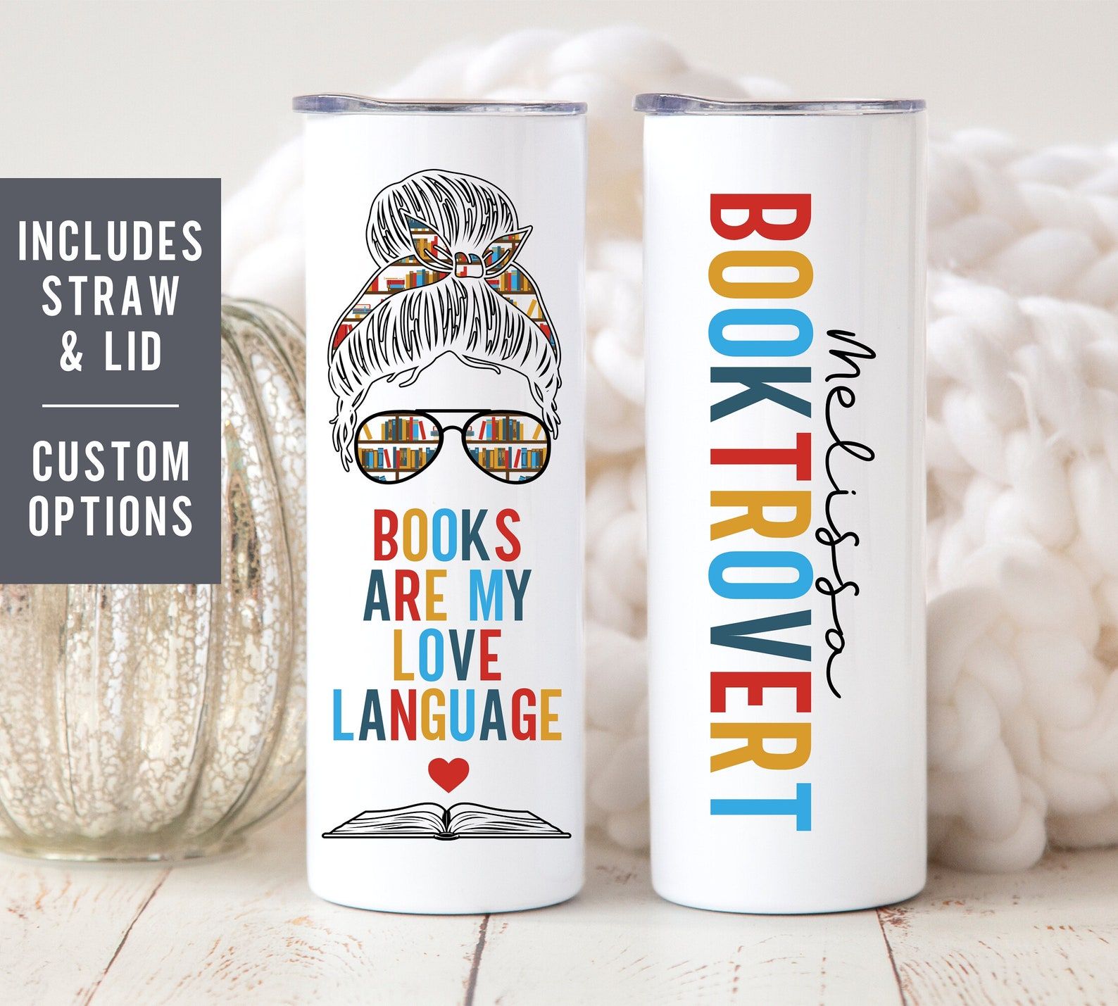 White tumbler with the text "booktrovert" and "books are my love language" with the black outline of a woman with sunglasses and books in her eyes. Also has space for name personalization.