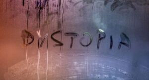 the word "dystopia" written on wet glass