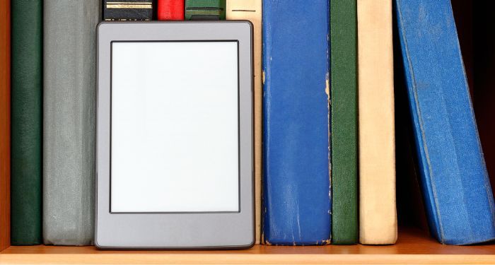 image of an ereader on a book shelf