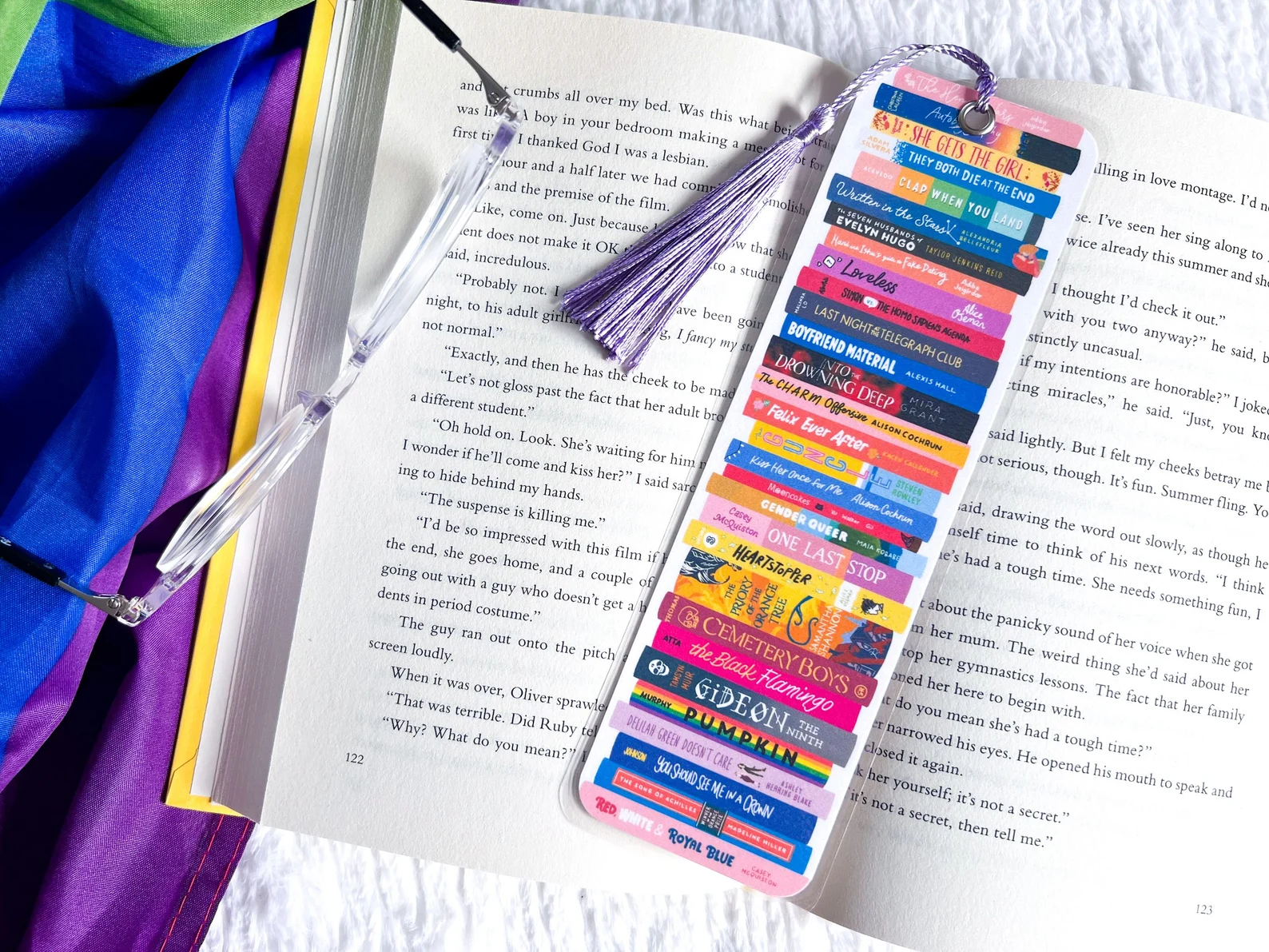 Image of a bookmark that is made up of queer bookspines. 