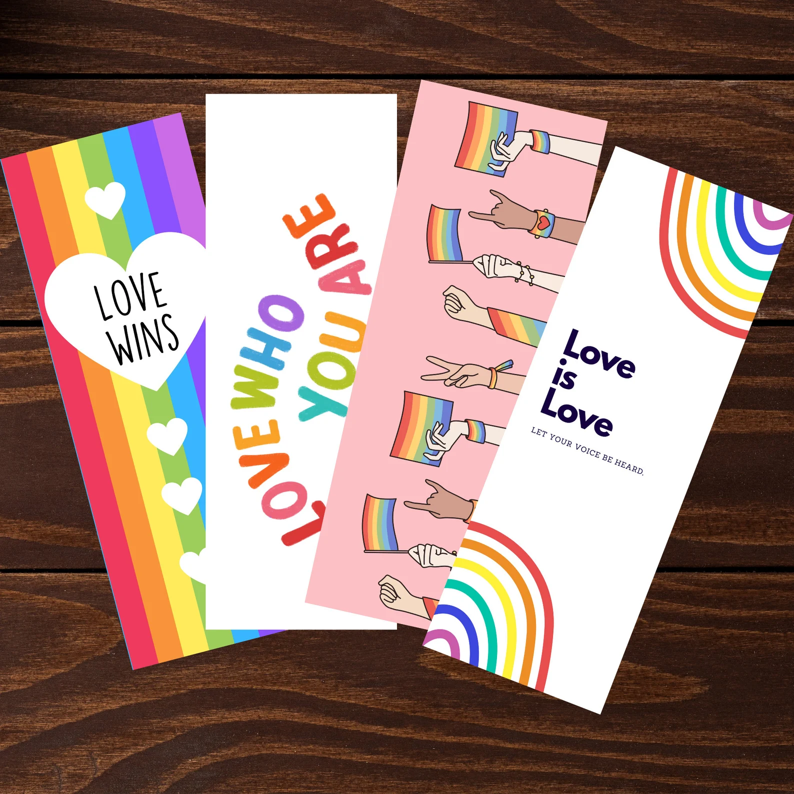 four colorful pride-themed bookmarks