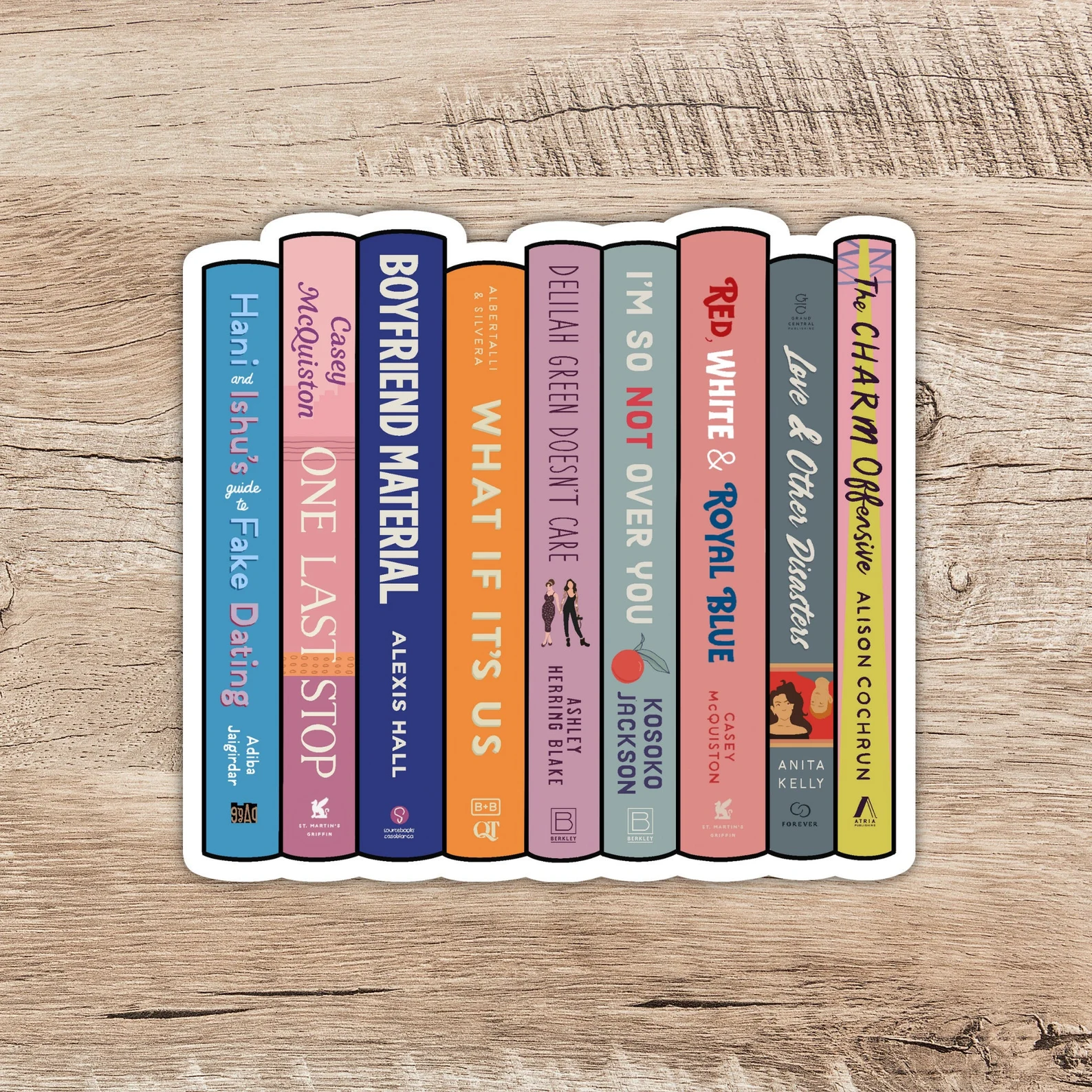 Image of a book stack featuring LGBTQ+ rom com book spines.