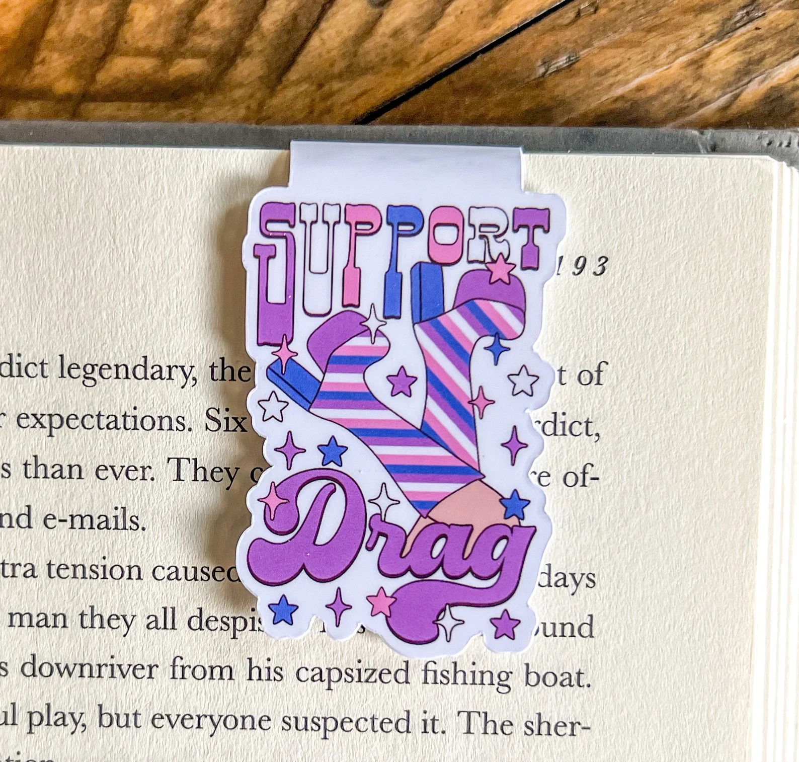 Image of a magnetic bookmark that says "support drag."