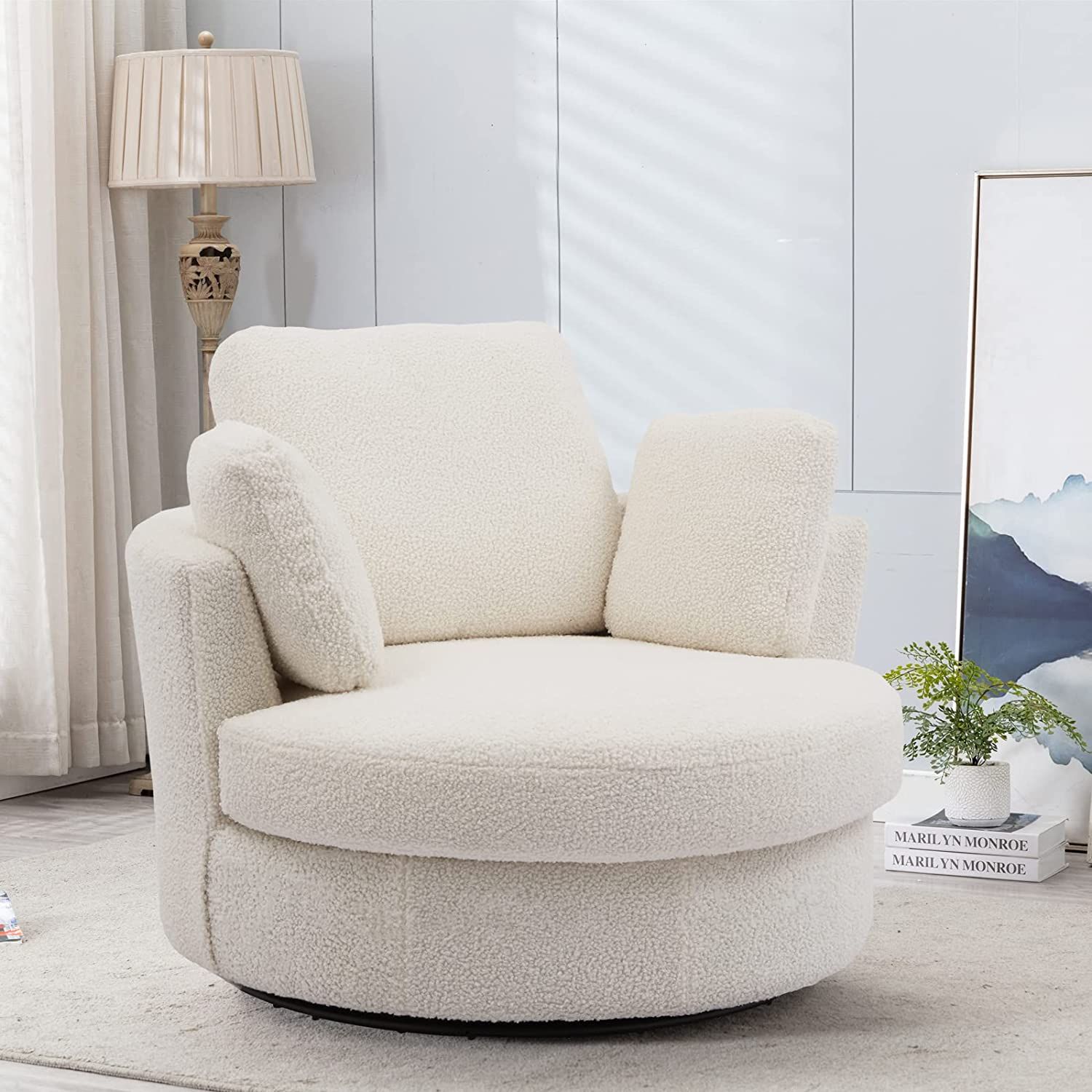 white oversized round swivel arm chair