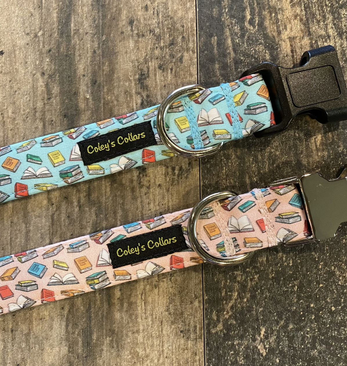 Two fabric dog collars with small cartoon book prints, one light pink and one light blue