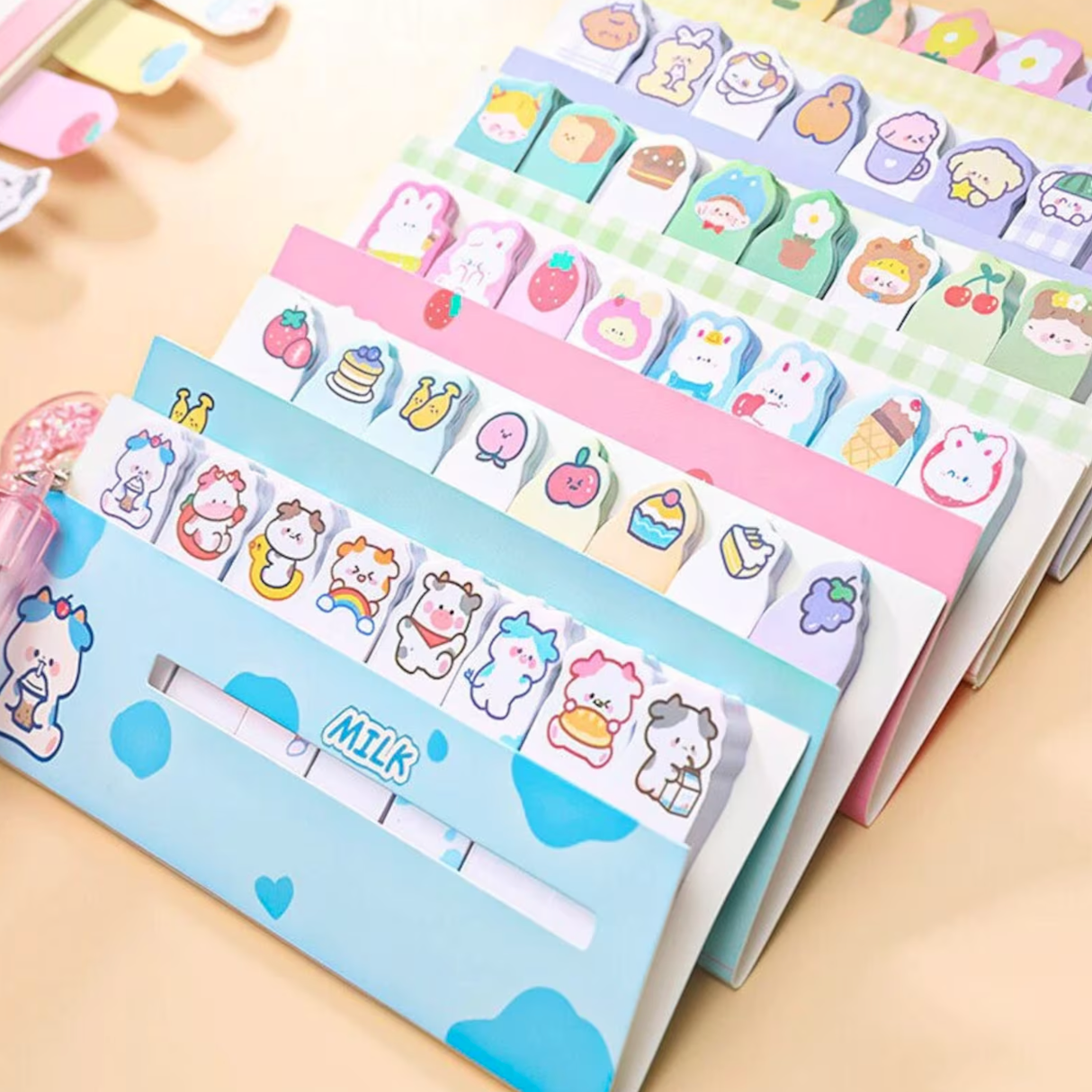 A selection of packs of pastel stick tabs, with cute drawings of animals, food, and cartoon creatures.