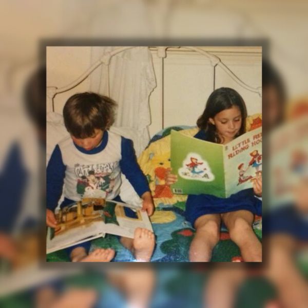 two kids reading together