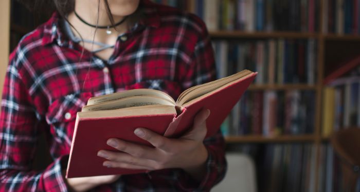 Image of a person reading a book