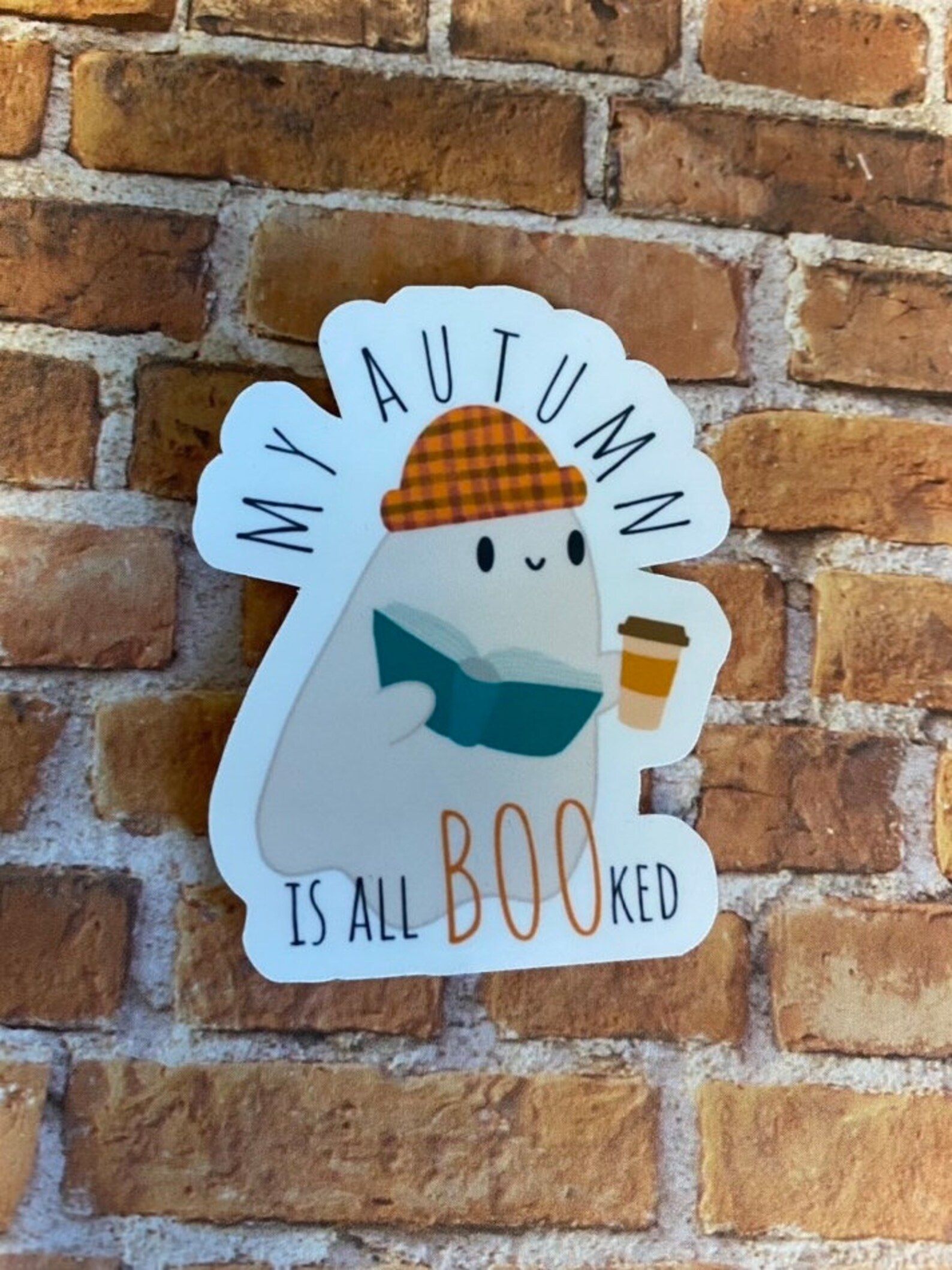 sticker of a ghost saying my autumn is all booked