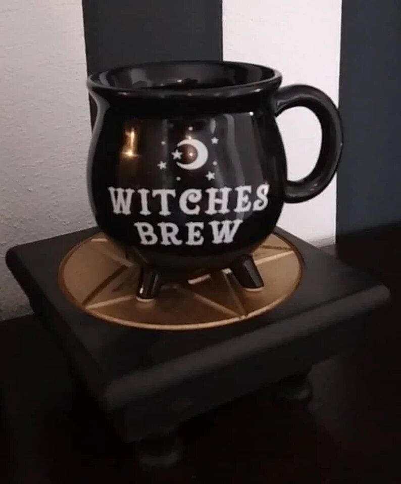 Cauldron-shaped mug that reads "Witches Brew"