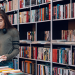 a photo of a woman browsing at a bookstore