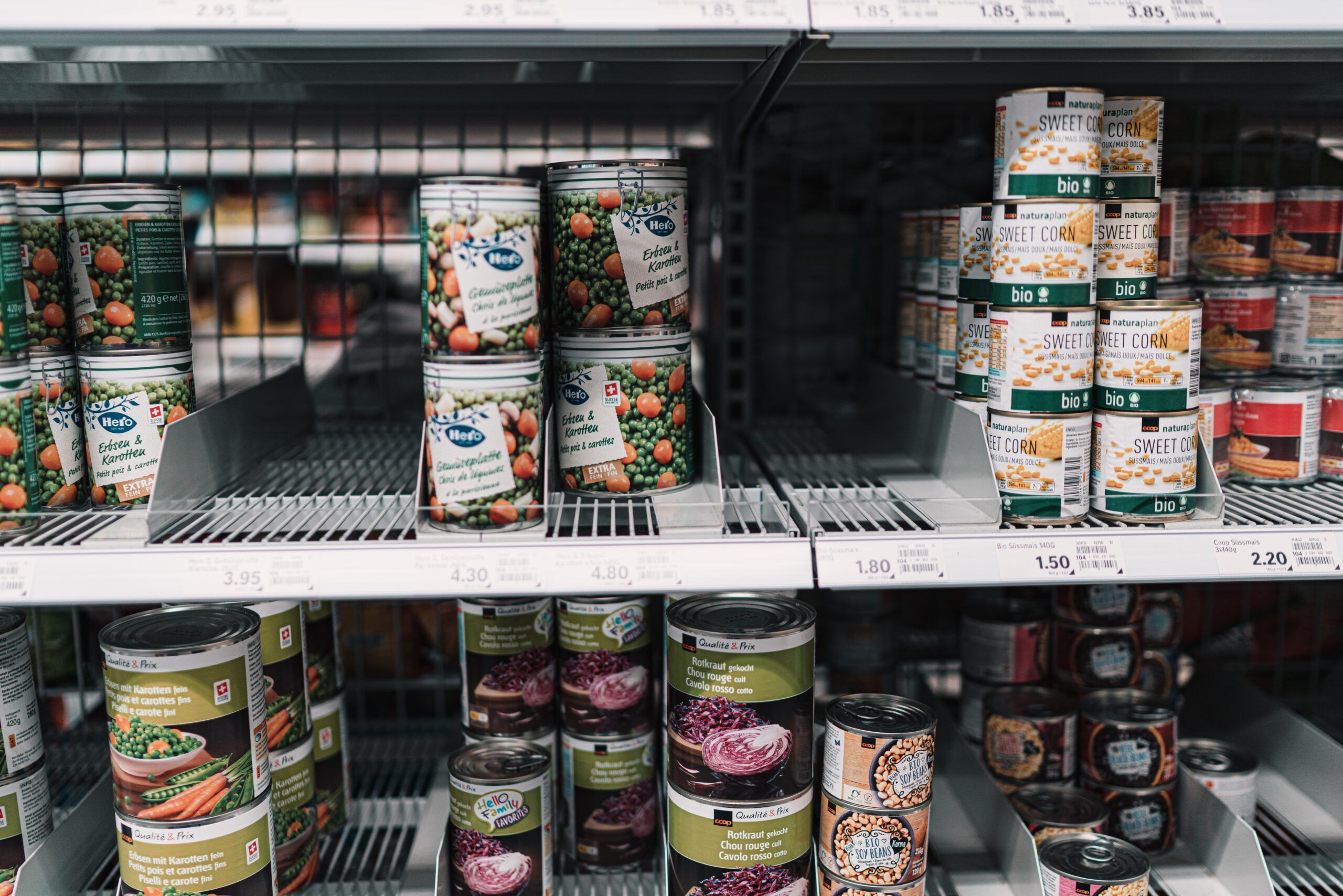 Grocery store shelves showing low stock of items