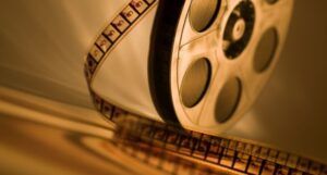 Image of a film reel in sepia
