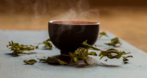 a photo of a steaming round mug of green tea