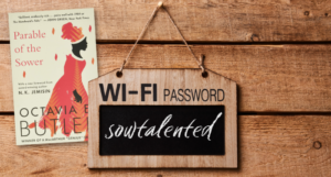 a graphic of a wifi password sign that says "sowtalented" beside the cover of Parable of the Sower