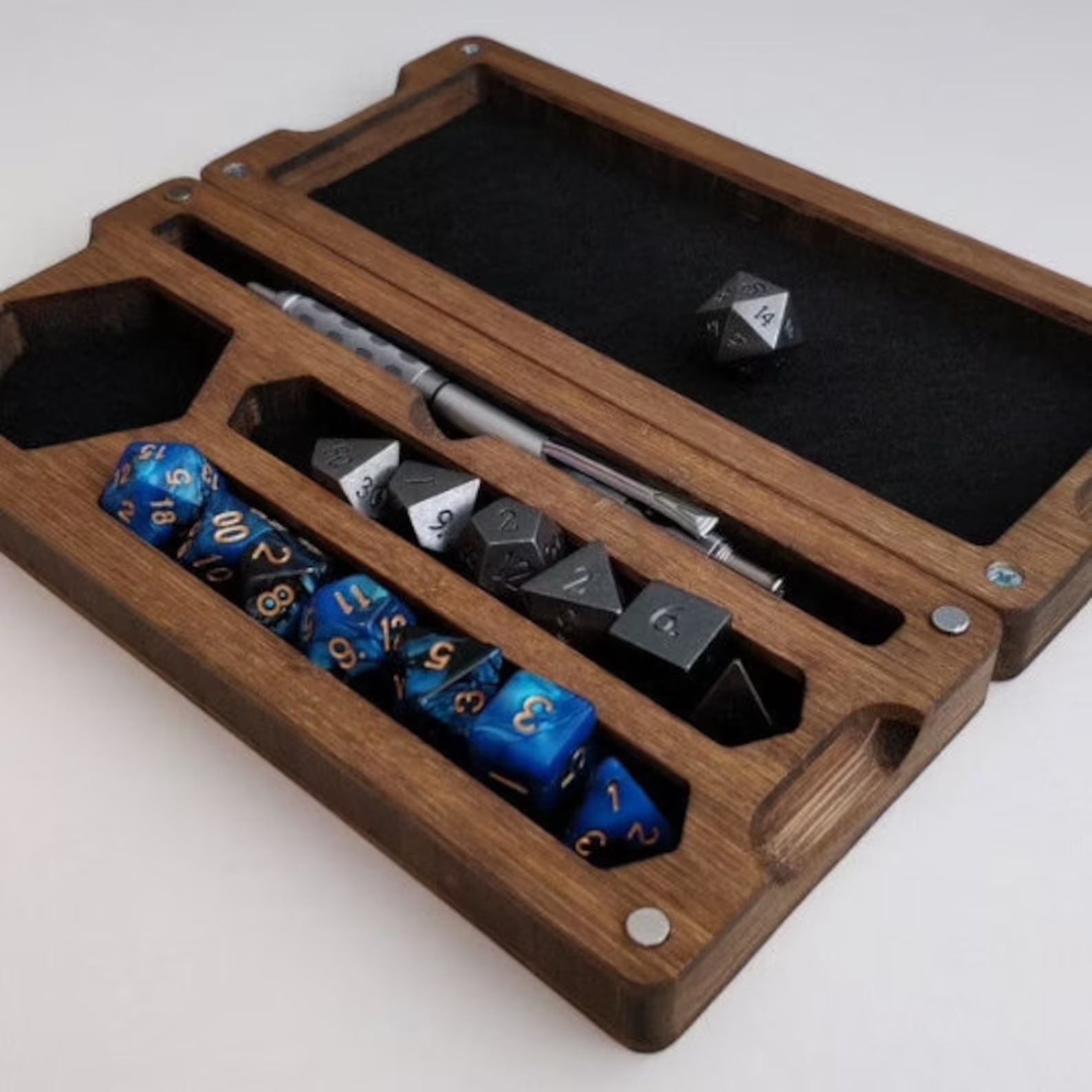 Bamboo dice storage box with a pen and dice inside. 