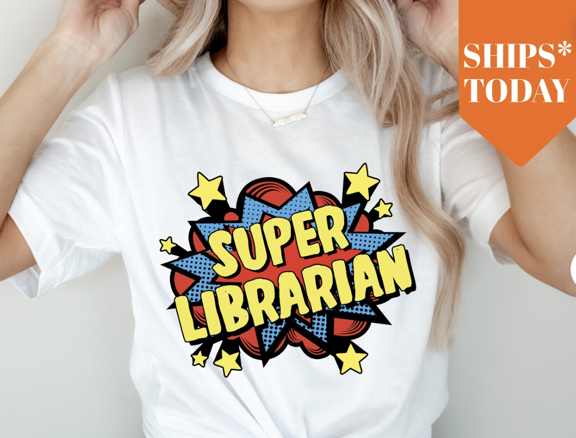 white tee with super librarian in comic font with red, blue, and yellow starburst