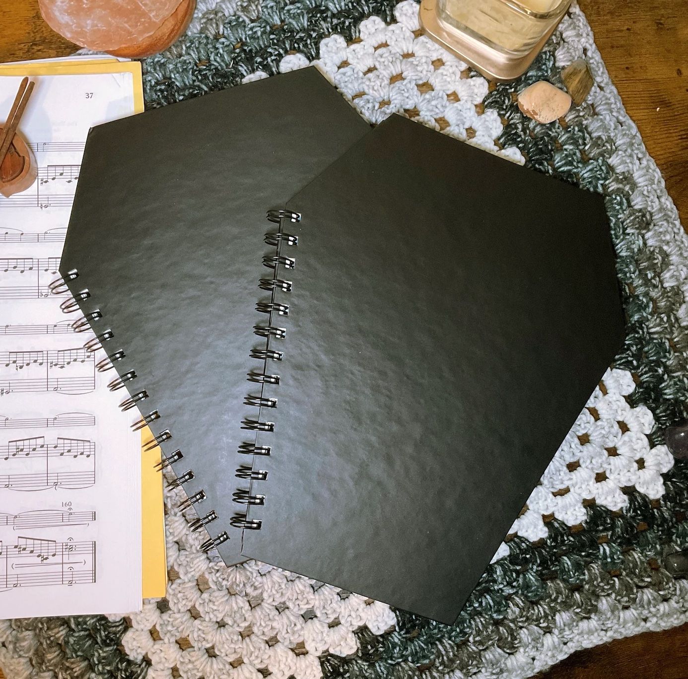 Black spiral notebook shaped like a coffin