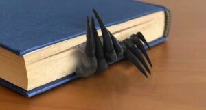devil's claw bookmark sticking out of a book