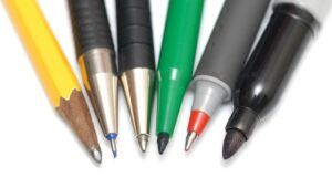Image of several pens, pencils, and markers