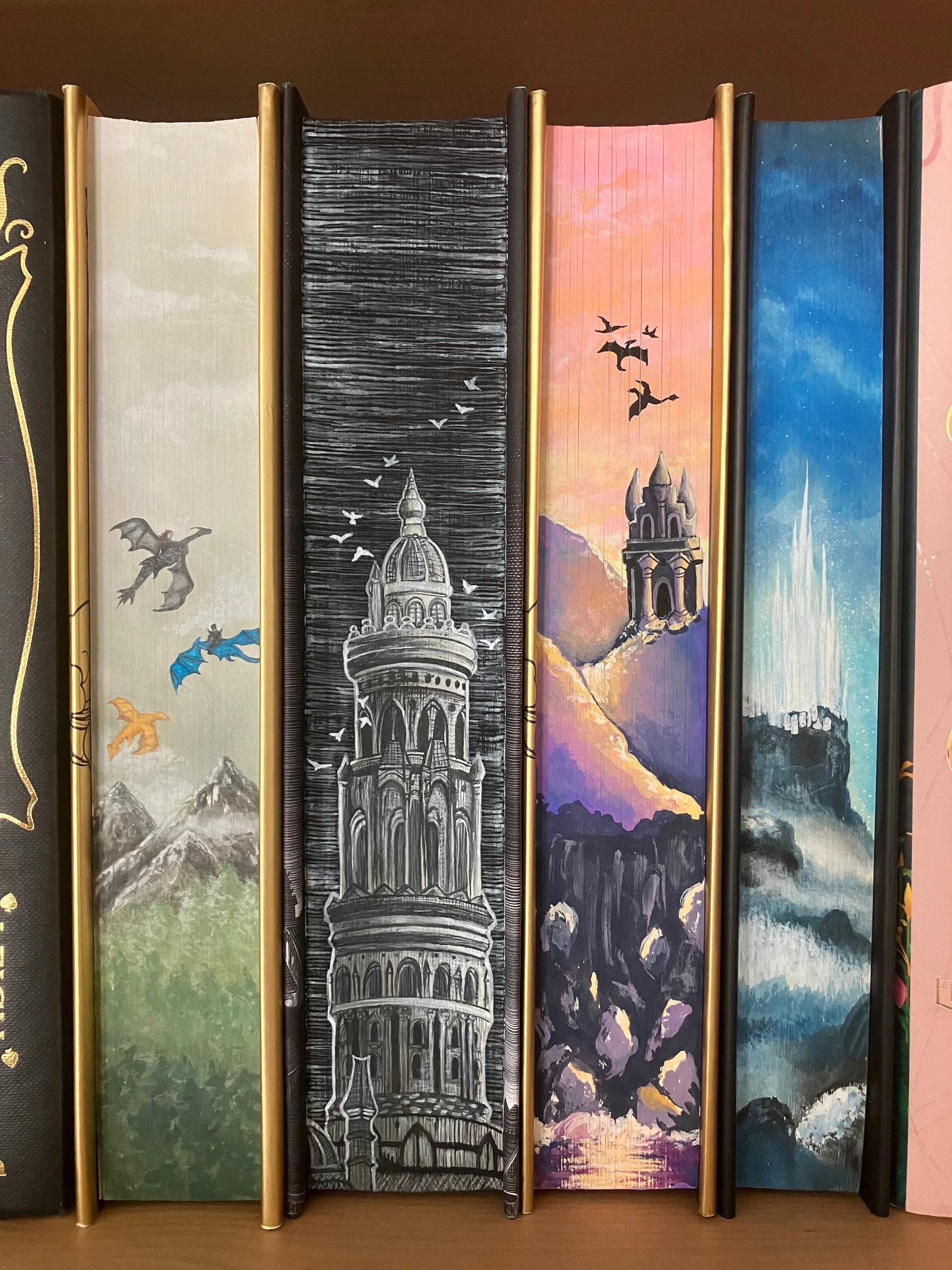 picture of multiple hand painted book edges done by inesasart