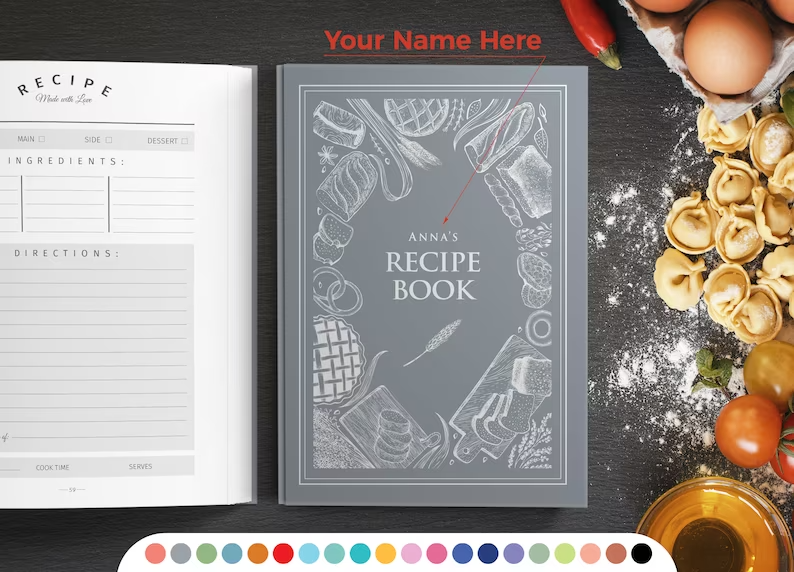 Photo of a recipe notebook with a personalised text at the centre and drawings of cake and bread around it