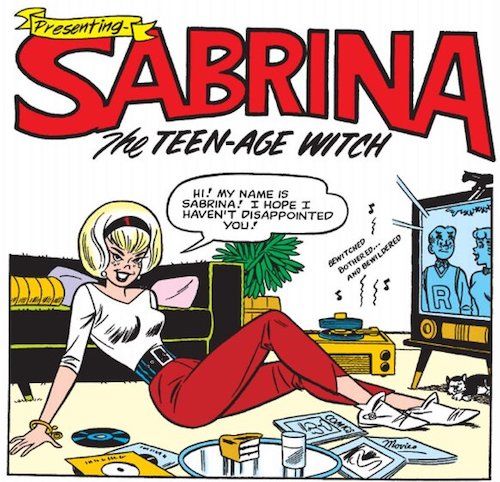 One panel from Archie's Madhouse #22. Sabrina is sitting on the floor in front of the TV, which shows Archie and Betty talking. Sabrina is a cute, blonde teenage girl smiling coyly at the reader and wearing a fashionable white boat neck top and red pedal pushers. She's surrounded by magazines and records. The record player is playing "Bewitched, Bothered, and Bewildered" and her logo is hanging above her head.
Sabrina: Hi! My name is Sabrina! I hope I haven't disappointed you!